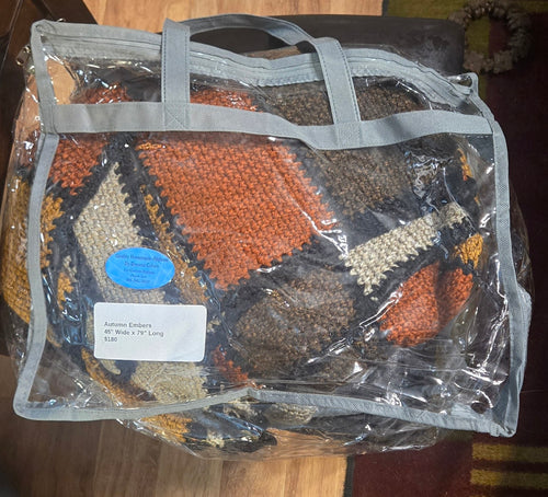 Autumn Embers handmade afghan in its protective storage case