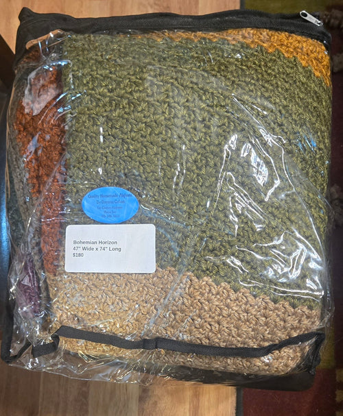 Bohemian Horizon handmade afghan in its protective storage case