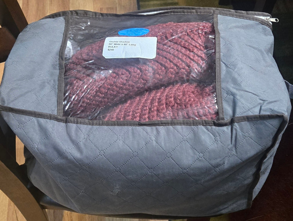 Orchid Shadow handmade afghan in its protective storage case