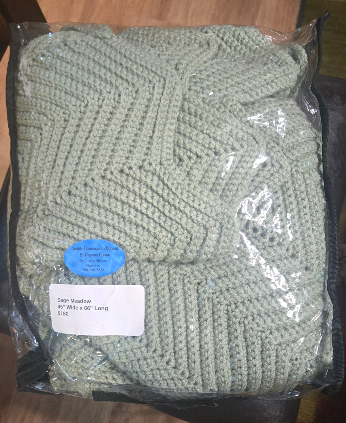 Sage Meadow handmade afghan in its protective storage case